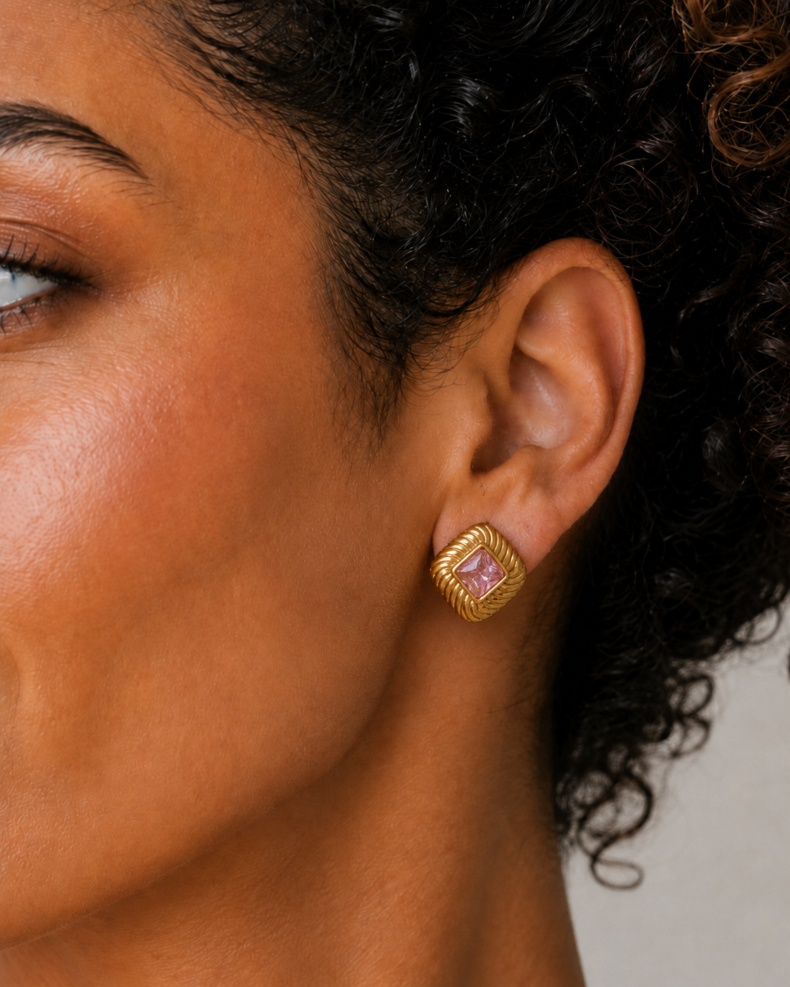 Gemma Earrings – gold square stud worn on a model