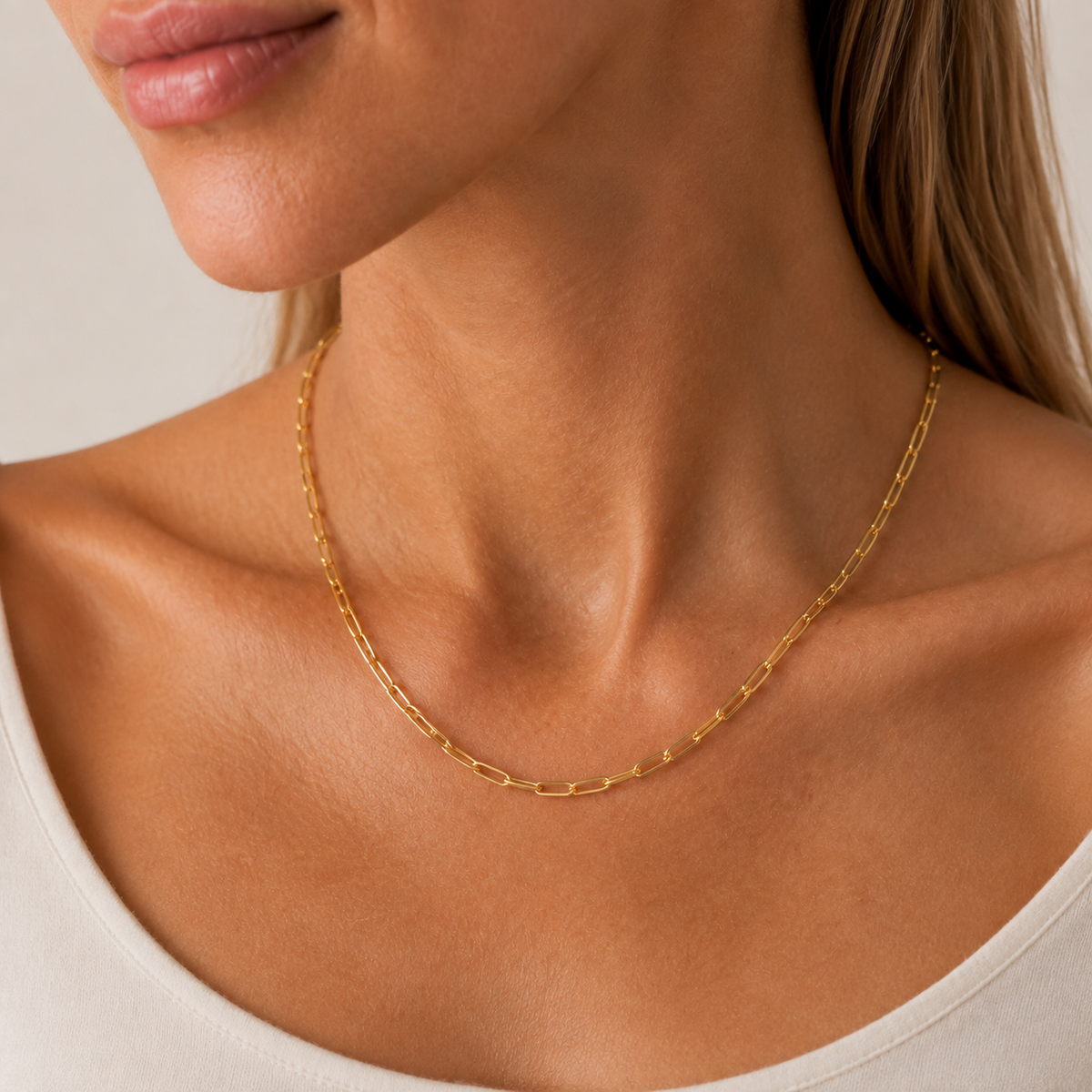 TAIA Maris Paperclip Necklace in gold worn at the collarbone