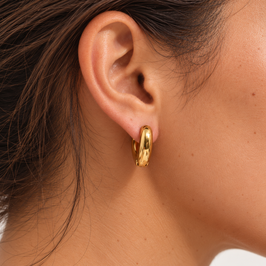 Elara Heart Hoop Earrings worn in side profile by a TAIA model — TAIA Jewellery
