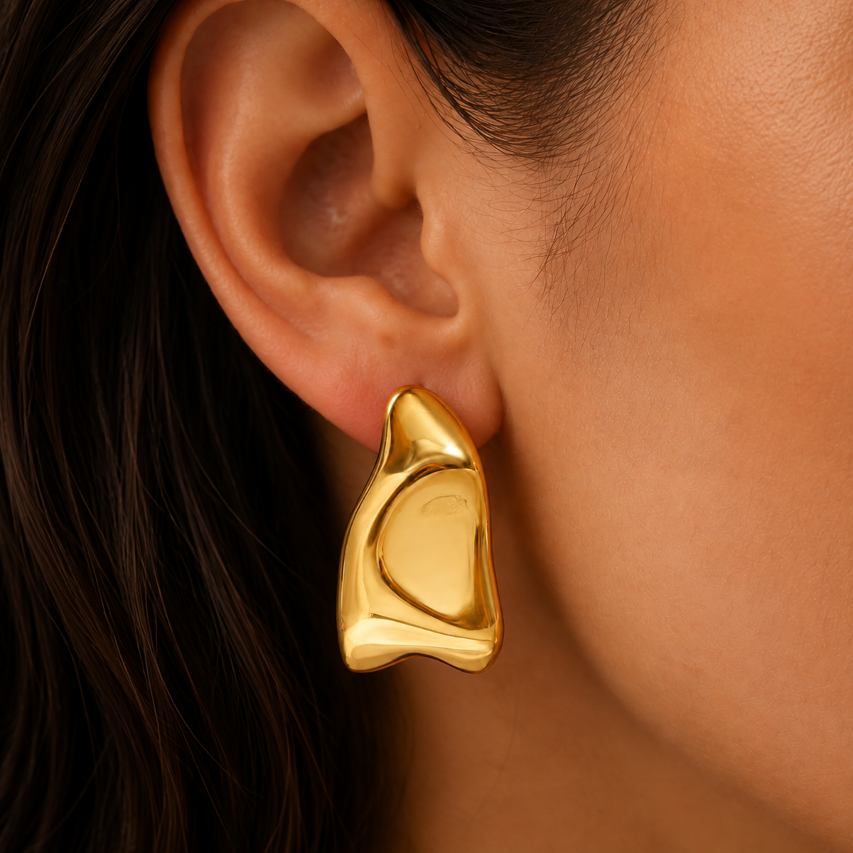 Elodie Earrings – gold sculptural earrings worn on model
