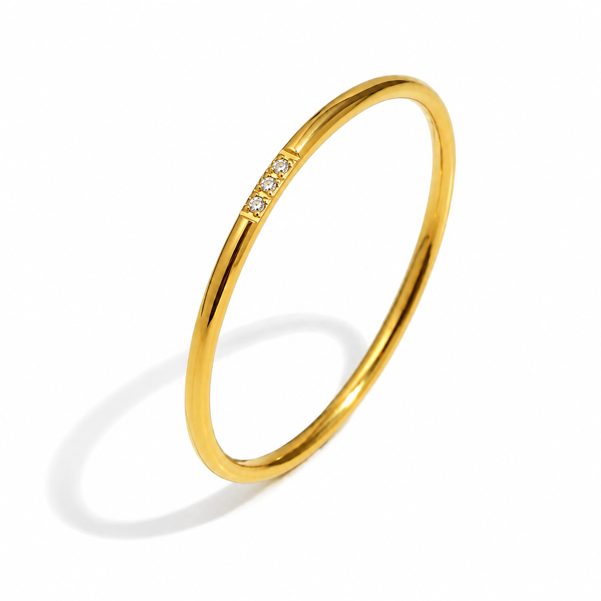 Eloise Zircon Stack Ring – slim gold band with three clear stones