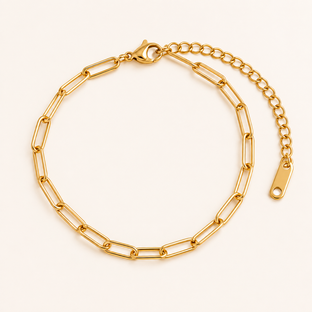 Maris Paperclip Bracelet — 18K gold PVD paperclip chain on a light ivory background