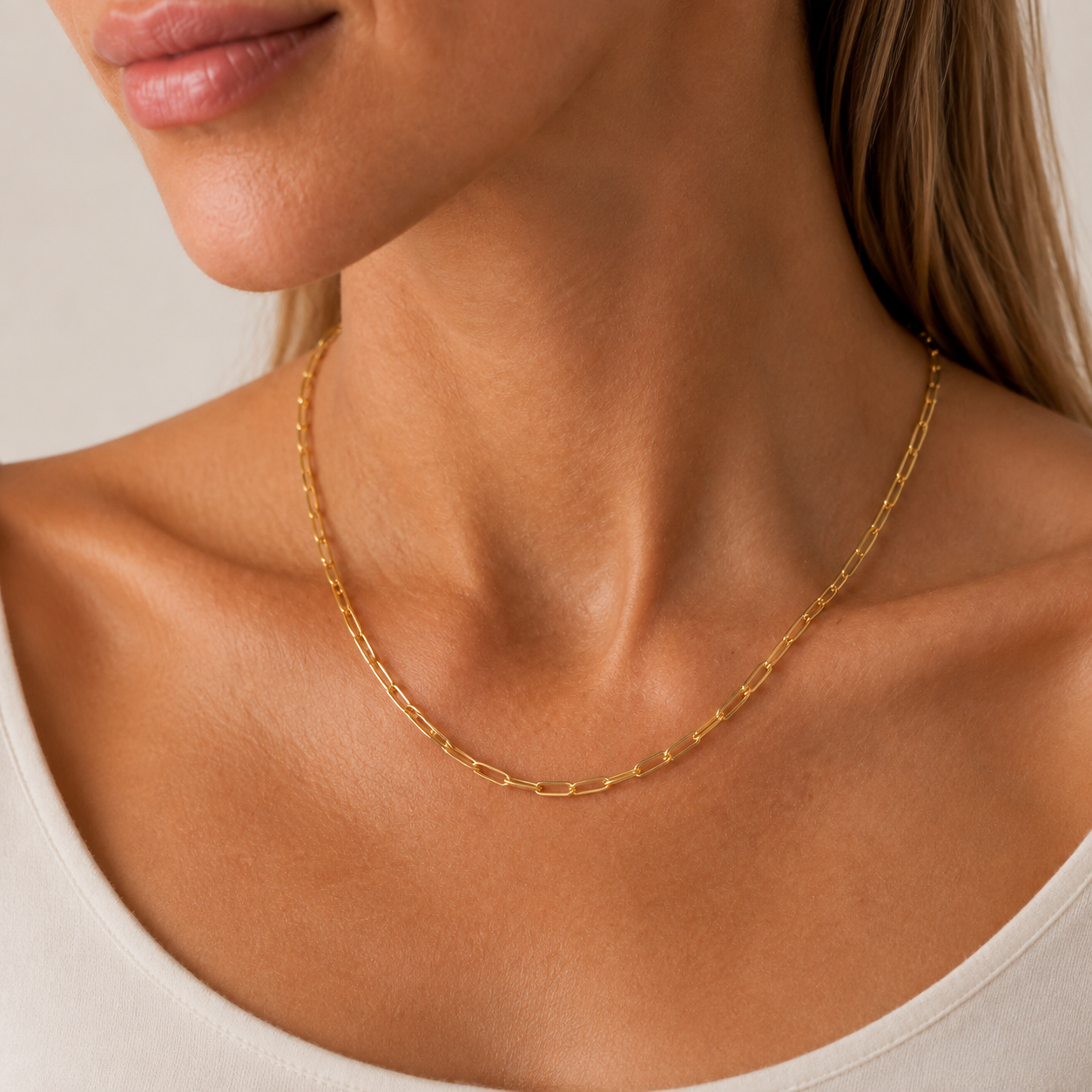 TAIA Maris Paperclip Necklace in gold worn at the collarbone