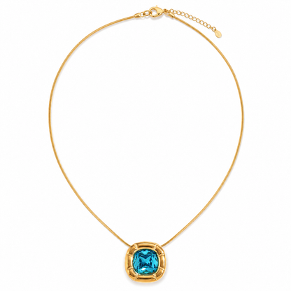 Paloma Cushion Stone Necklace – gold chain with a blue cushion-cut pendant on white