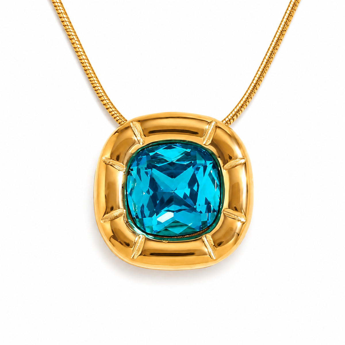 Paloma Cushion Stone Necklace – close-up of the blue cushion-cut stone and sculptural gold frame