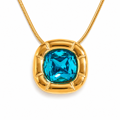 Paloma Cushion Stone Necklace – close-up of the blue cushion-cut stone and sculptural gold frame