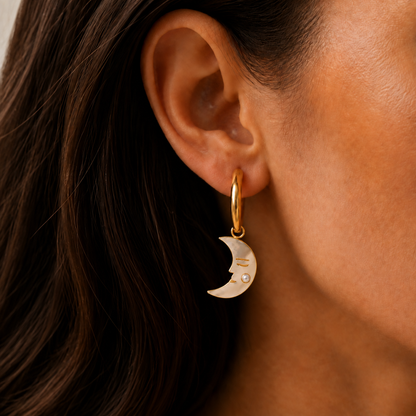 Selene Pearl Earrings – gold hoop with a pearly crescent moon charm worn on an ear