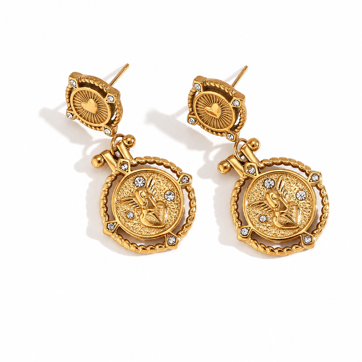 Seraphine Charm Earrings – gold heart studs and angel medallion drops with clear stone accents on white