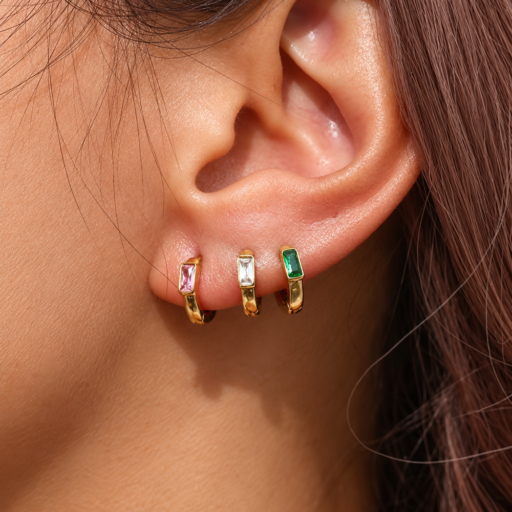 Ciel Baguette Huggies in Pink, Clear and Green worn together in a close-up