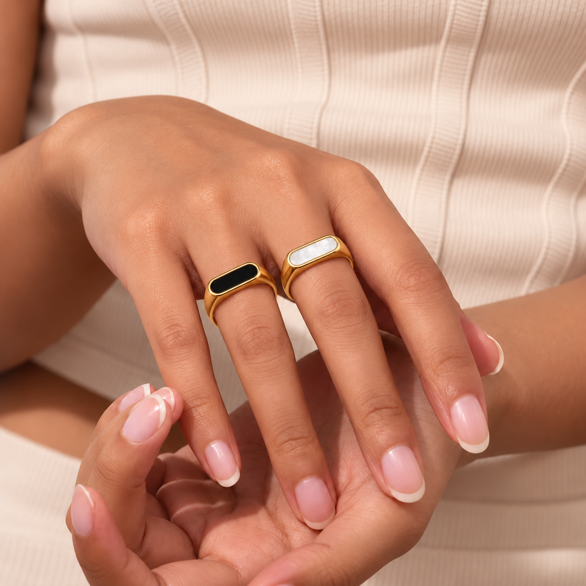 Esmé Shell Signet Rings in black and white styled naturally on a TAIA model