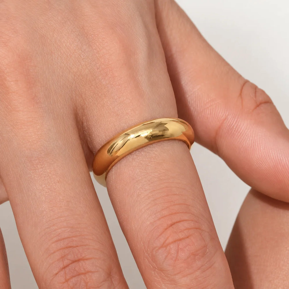 Alba Ring – gold dome band worn on hand