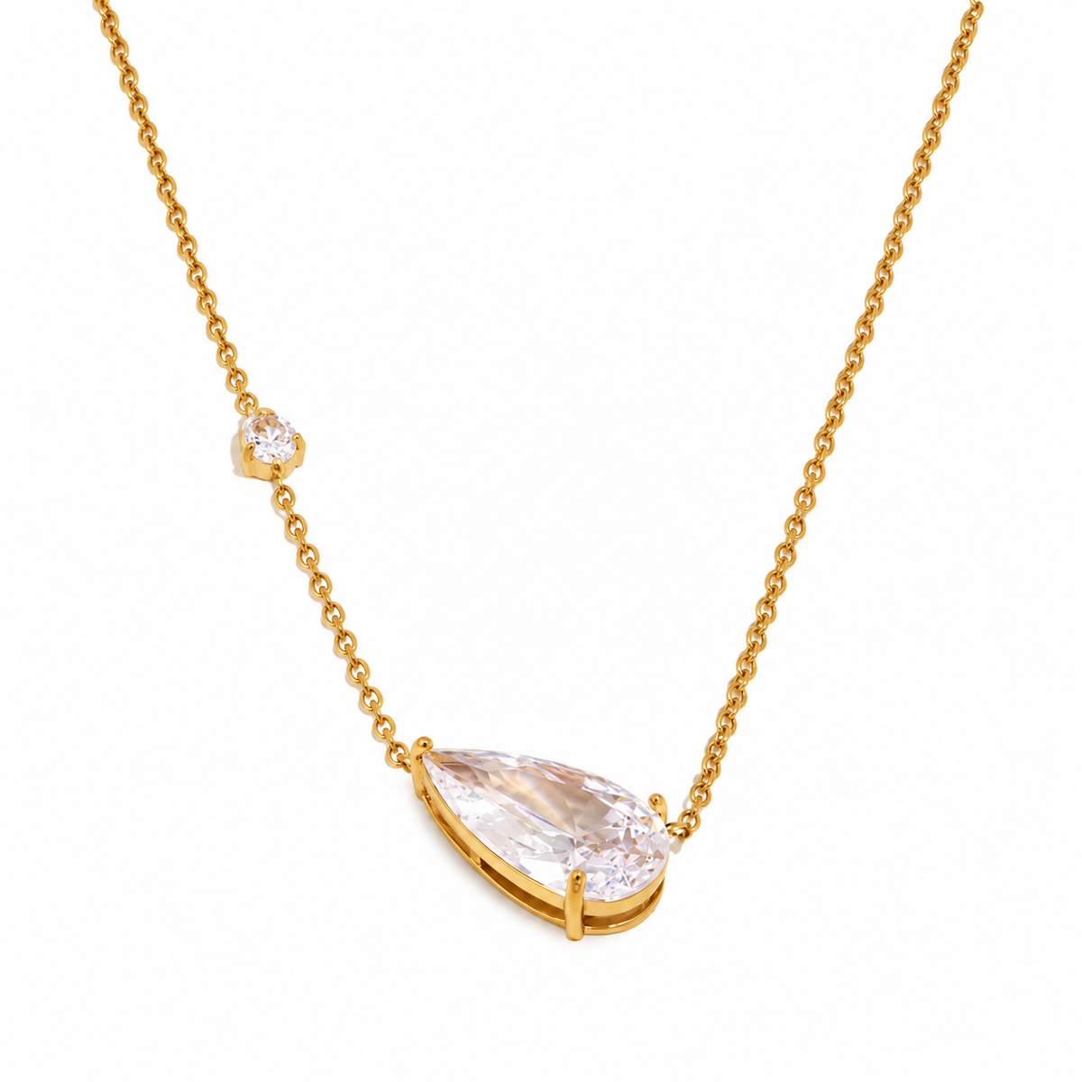 Luma Teardrop Necklace in gold with clear pear-cut zircon, front detail view