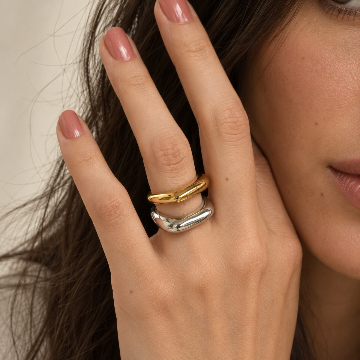 Maëlle Sculpted Square Ring in gold and silver worn by a model — TAIA Jewellery