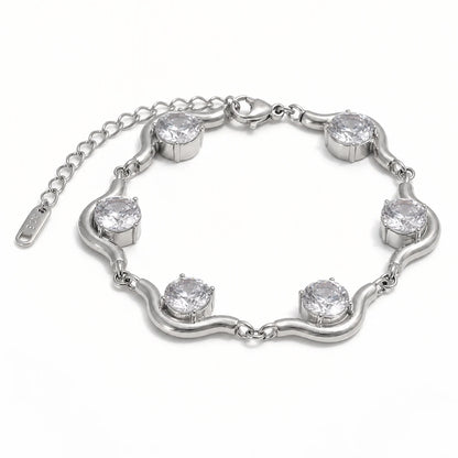 Ondula Bracelet – silver curved links with round clear stones on white