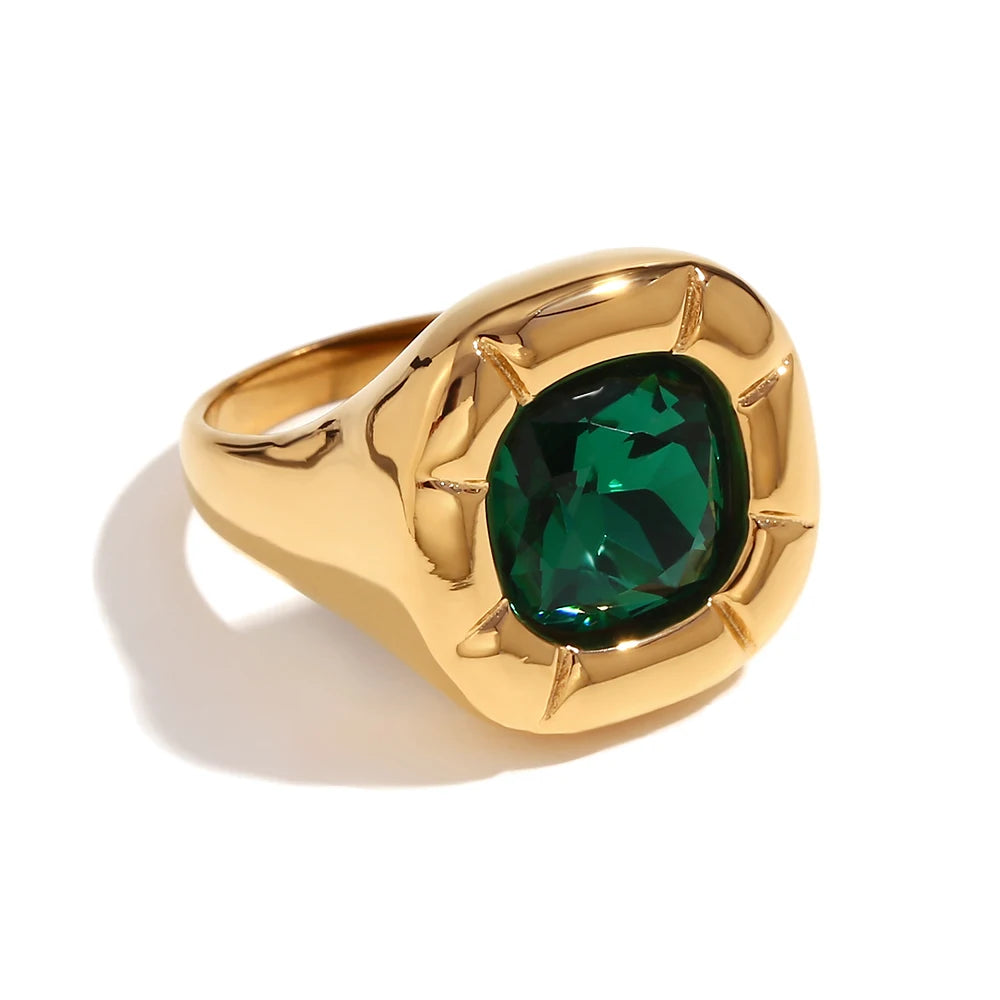 Paloma Cushion Stone Ring – green cushion-cut stone in a sculptural gold ring on white