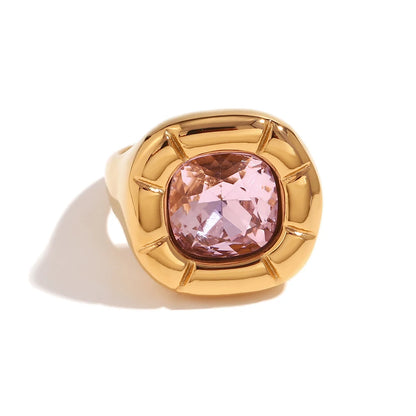 Paloma Cushion Stone Ring – pink cushion-cut stone in a sculptural gold ring on white