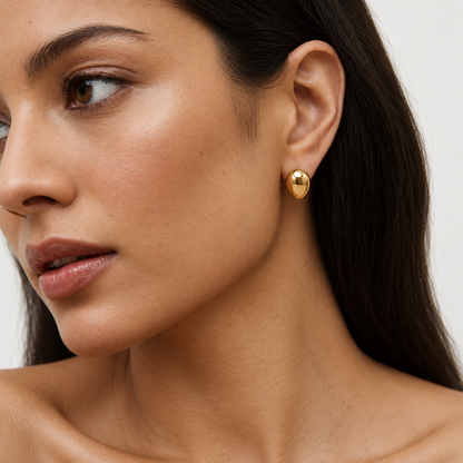 Pebble Earrings in gold worn by a model — TAIA Jewellery