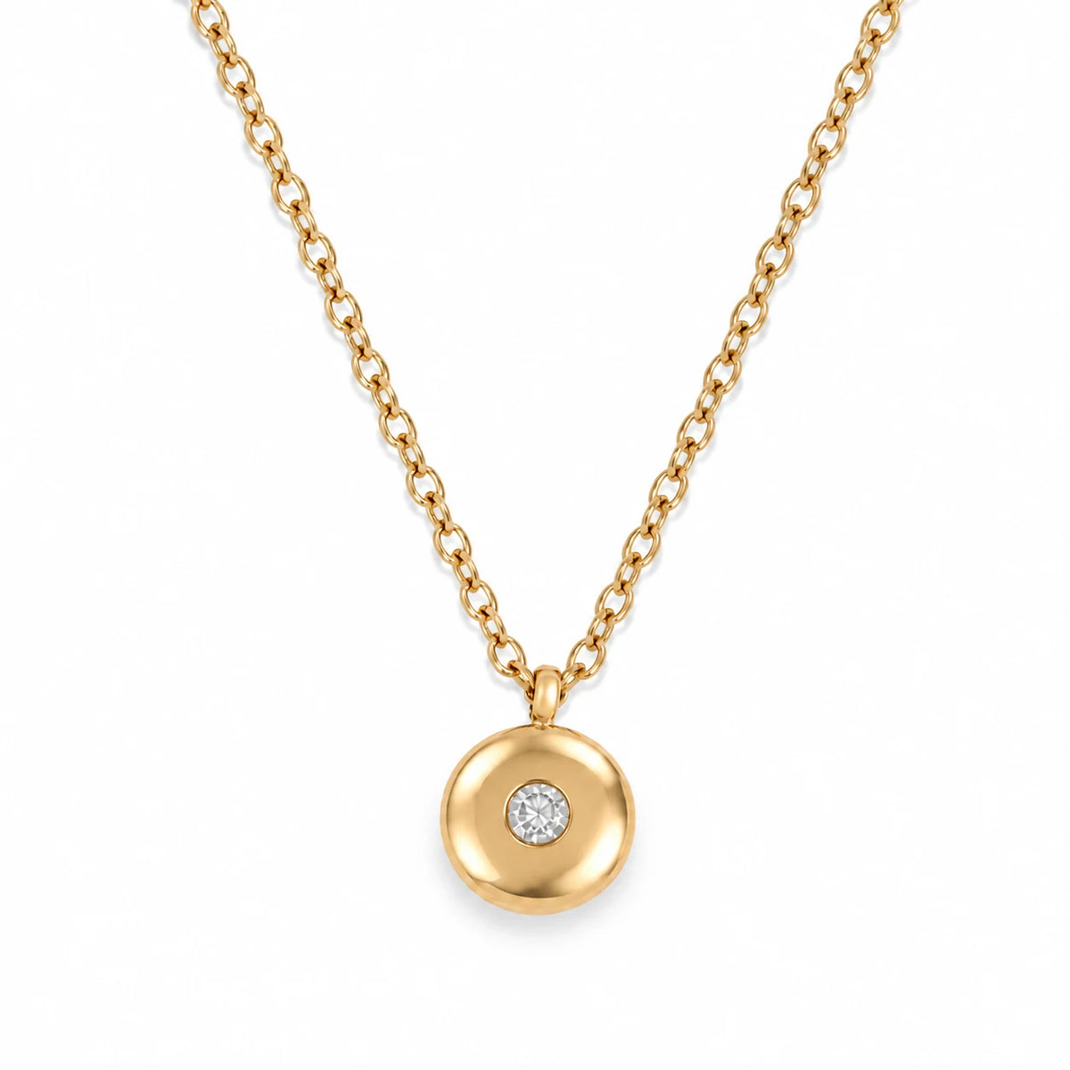 Ruth Birthstone Necklace – April – polished gold birthstone pendant on white
