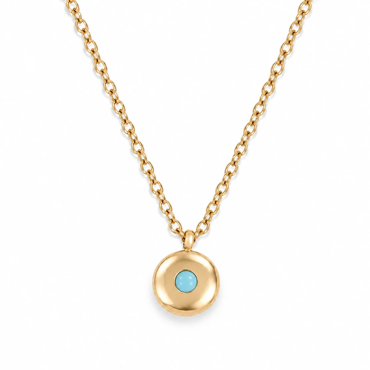 Ruth Birthstone Necklace – December – polished gold birthstone pendant on white