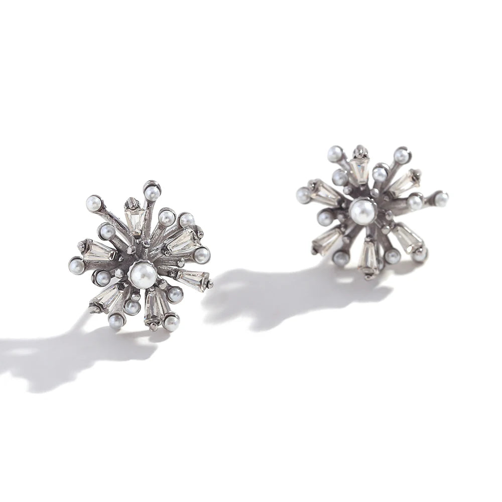 Solara Pearl Earrings – silver floral studs with white pearls and tapered clear stones on white