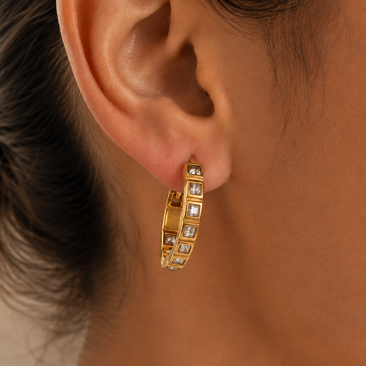 Vera Zircon Hoop Earrings – gold hoop with square clear stones worn on the ear